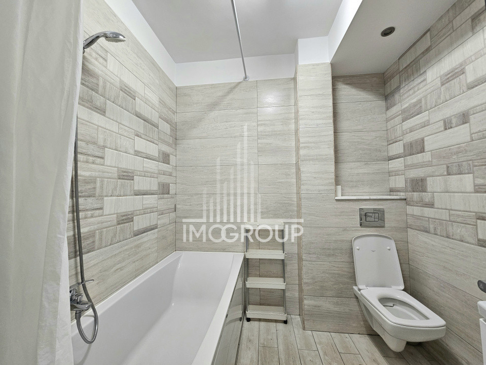 Apartament modern de închiriat 3 camere, 2 băi, 75 mp utili, garaj