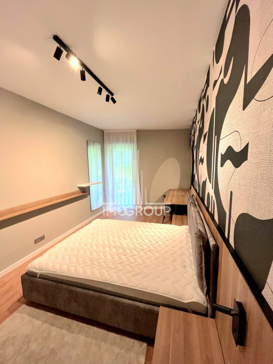 Inchiriez apartament NOU 2 camere cu grădină, garaj prima închiriere