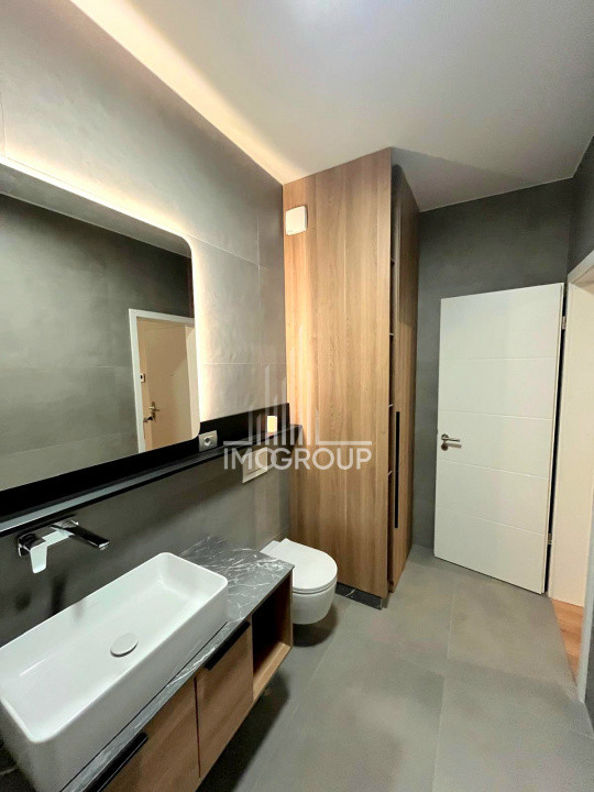 Inchiriez apartament NOU 2 camere cu grădină, garaj prima închiriere