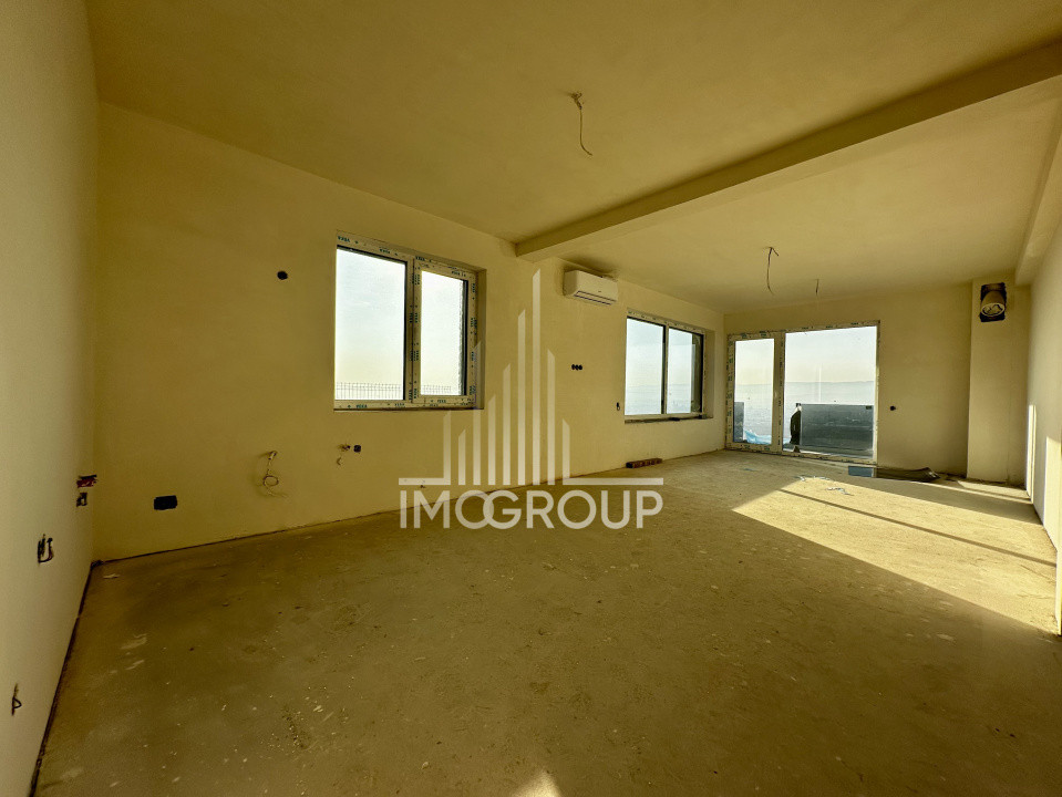 Duplex modern NZEB cu rooftop panoramic și garaj, situat pe o stradă liniștită, 